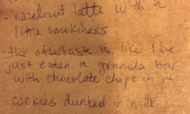 In the dark of the bar, we scribbled down our reactions to the latte. (Photo by Jordyn Taylor)