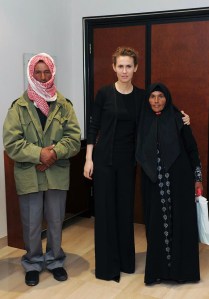 The PR Firm Brown Lloyd James was paid a reported $5000 a month by the Syrian Government to manage a fawning  Vogue profile for First Lady Asma al-Assad, pictured here in a shot from last October on the official Facebook page of the Syrian Presidency, "posing for a picture with family members of martyrs" in Damascus. (AFP/Facebook/Getty Images)