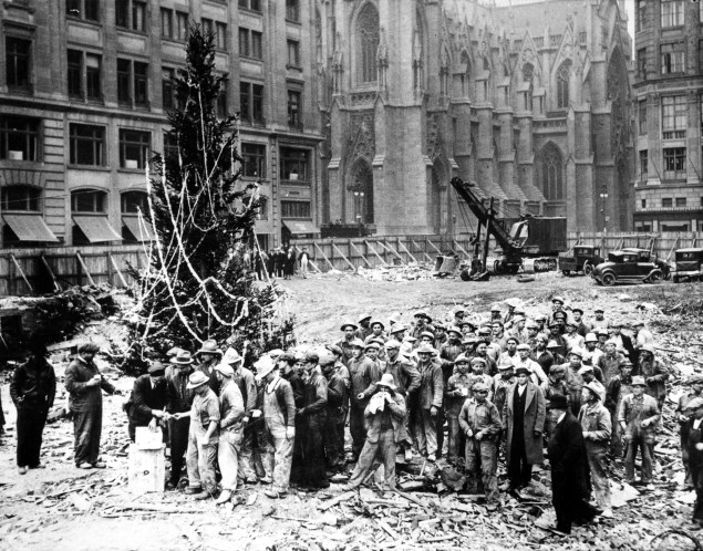 The first tree is erected by the Rockefeller's construction workers in 1931.