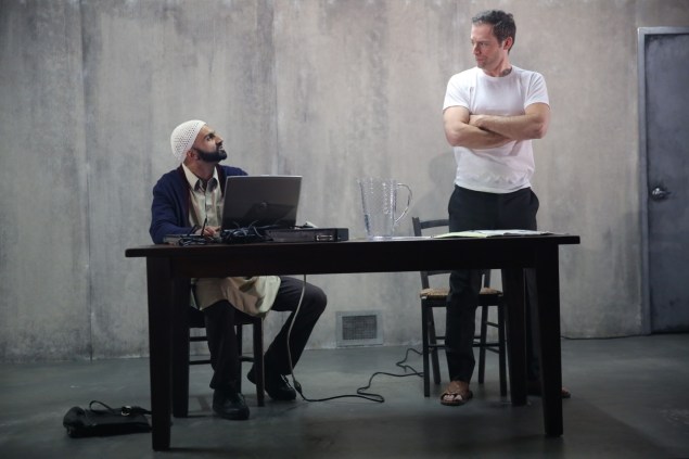 Usman Ally and Justin Kirk in The Invisible Hand.