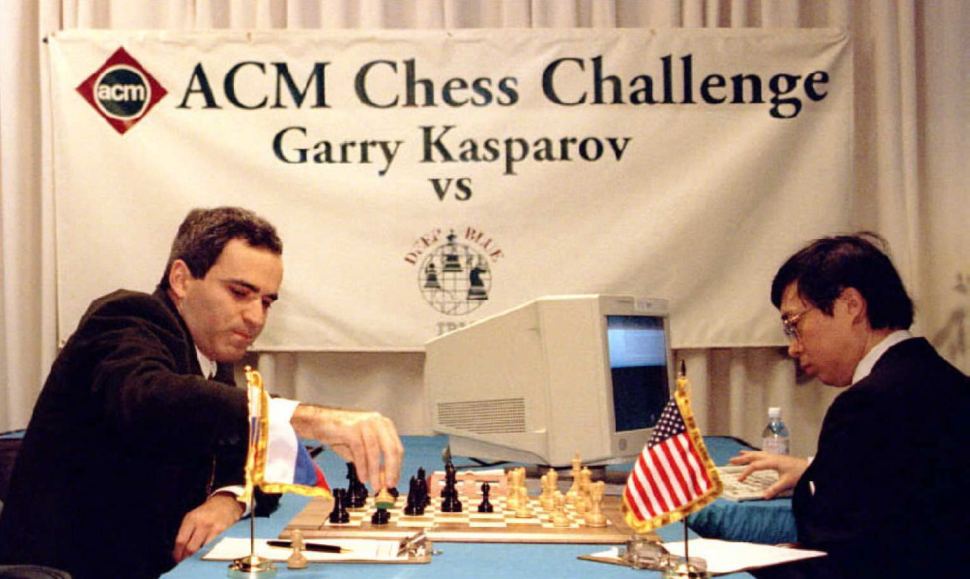 World chess champion Garry Kasparov takes a pawn in a match against IBM's "Deep Blue" computer in Philadelphia, February 1996. Feng-hsiung Hsu, R, the principal designer of "Deep Blue," keys a move into the computer. (TOM MIHALEK/AFP/Getty Images)
