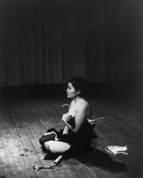 Cut Piece (1964) performed by Yoko Ono in New Works of Yoko Ono, Carnegie Recital Hall, New York, March 21, 1965. (Photograph by Minoru Niizuma. © Minoru Niizuma. Courtesy Lenono Photo Archive, New York)