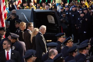 Governor Andrew Cuomo, his girlfriend Sandra Lee, Joe Biden and his wife Jill watched the procession following the funeral. (Photo by Kevin Hagen/Getty Images)