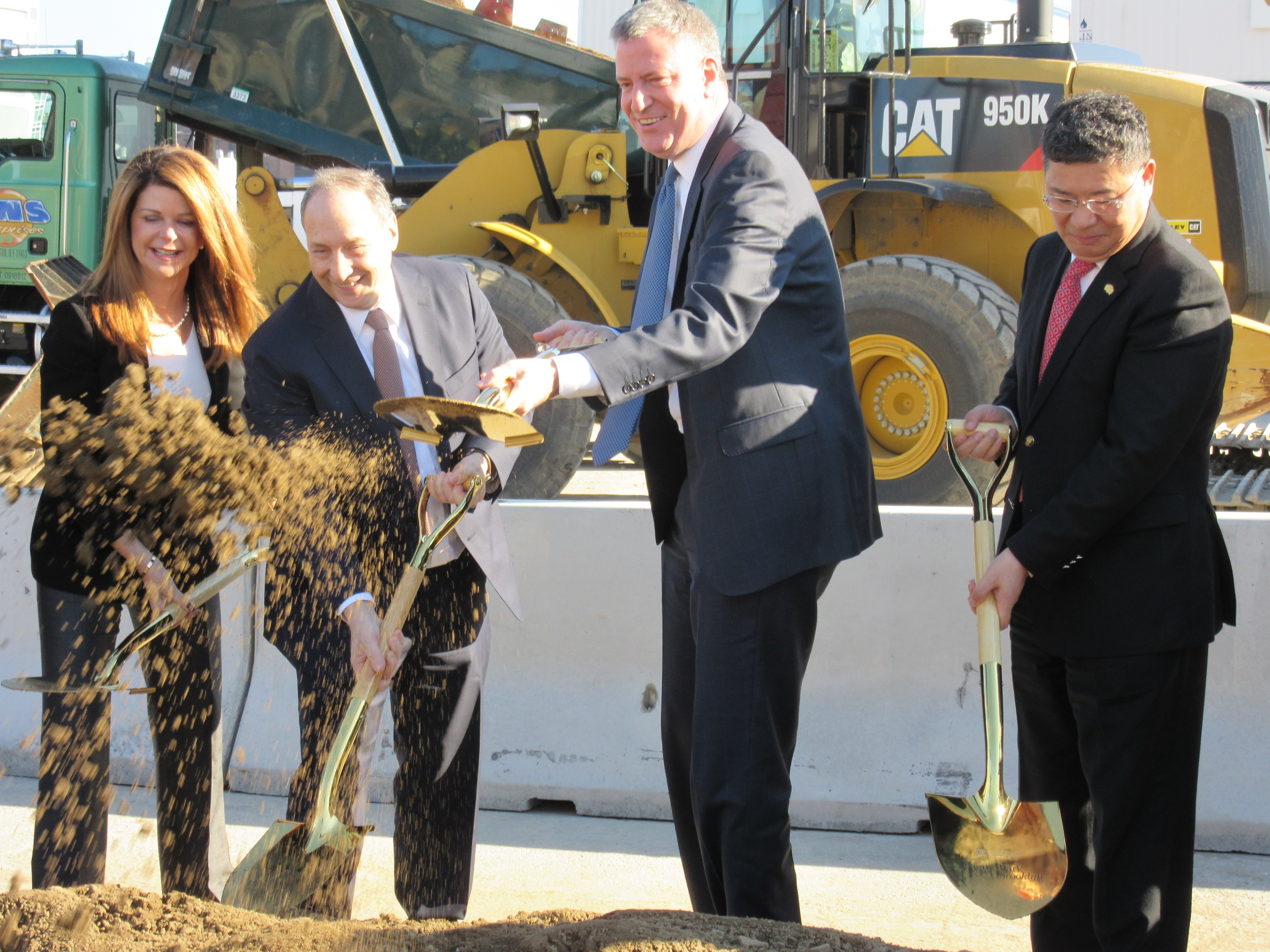 Mayor Bill de Blasio shovels dirt with top executives from Forest City Ratner and Greenland Group (Photo: Will Bredderman).