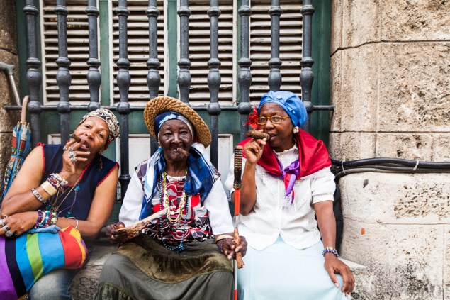 Cigar smokers hanging out on Obispo Street in Havana, Cuba. (Photo by Emily Assiran)