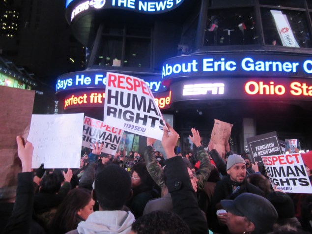 1199 SEIU members and other activists gather in Times Square (Photo: Will Bredderman).