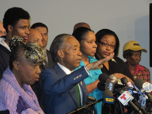 Rev. Al Sharpton surrounded by the family of Eric Garner.