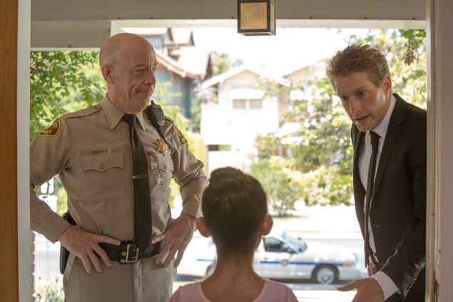 J.K. Simmons, left, and Fran Kranz on the hunt for an unfortunate feline.