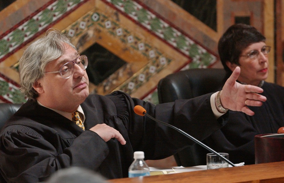 Judge Alex Kozinski (L), of the 9th U.S. Circuit Court of Appeals, pictured here in 2003 in San Francisco, has indicated that the judiciary is finally ready to stop prosecutors from lying and soliciting others to lie. (Paul Sakuma-Pool/Getty Images)