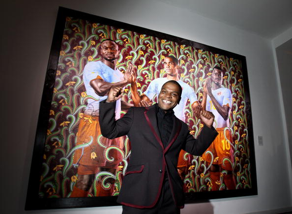 Artist Kehinde Wiley stands in front of one of his paintings (Photo: Andreas Rentz/Getty Images for PUMA).