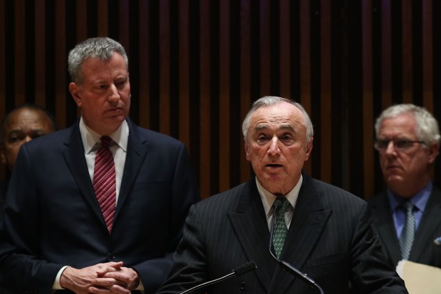 Police Commissioner Bill Bratton speaks today at 1 Police Plaza as Mayor Bill de Blasio looks on. (Photo by Spencer Platt/Getty Images)