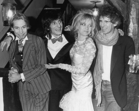 Charlie Watts (left) and Keith Richard (right) were the best men at Ronnie Wood's marriage to Jo Wood on Jan. 2, 1985. (Photo via Getty)