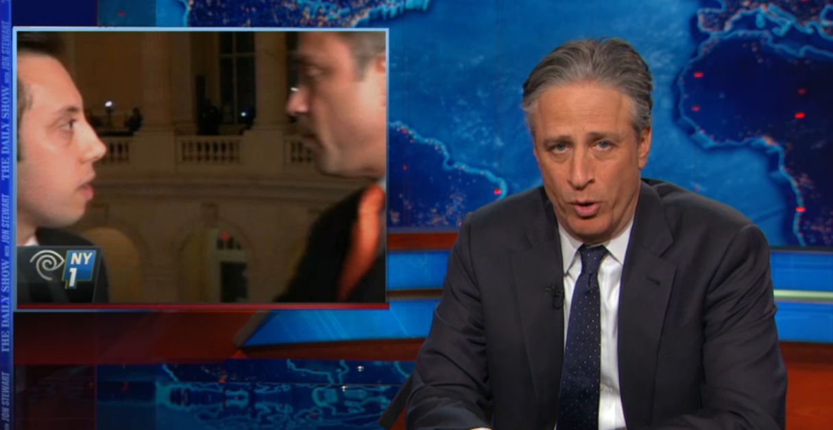 Jon Stewart mocking Congressman Michael Grimm's encounter with NY1 reporter Michael Scotto (Screengrab: Comedy Central).