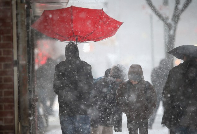 A person with an umbrella in the snow. (Photo: Getty Images)