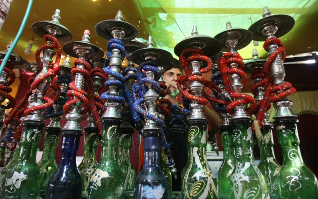 A Palestinian worker makes ready flavoured tobacco water pipes or 'shisha' prior to the evening influx of customers in Gaza City on July 17, 2010, as the ruling Islamic Hamas party tries to impose a ban on smoking water pipes in public. MAHMUD HAMS/AFP/Getty Images