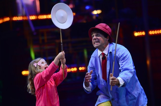 Clown Rob Torres plays his act with a young audience member during "Luminocity" by the Big Apple Circus in New York. EMMANUEL DUNAND/AFP/Getty Images