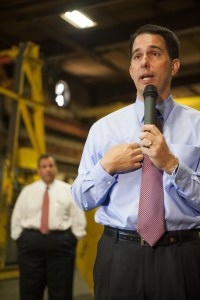 Walker speaks as Christie looks on; Walker surprised some by attracting donors from New York and even New Jersey during a recent NYC blitz. (Stephen Maturen/Getty Images)