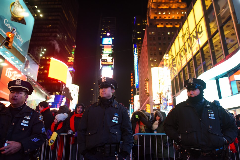 New York Police Department patrol in Times Square on December 31, 2014 in New York City. With an estimated one million people packing into Times Square and elsewhere around the city, New York has stepped up security measures. (Photo by Andrew Theodorakis/Getty Images)