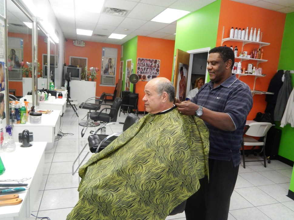 Fajardo getting a haircut in Elizabeth on Election Day last year.