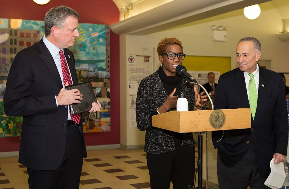 NYCHA Chairwoman and CEO Shola Olatoye flanked by Mayor Bill de Blasio and Senator Charles Schumer (Photo: Facebook).