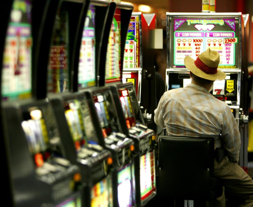 A late night gambler plays the slot machines 03 May 2005 in Las Vegas,Nevada. AFP Photo/Paul J. RICHARDS (Photo credit should read PAUL J.RICHARDS/AFP/Getty Images)