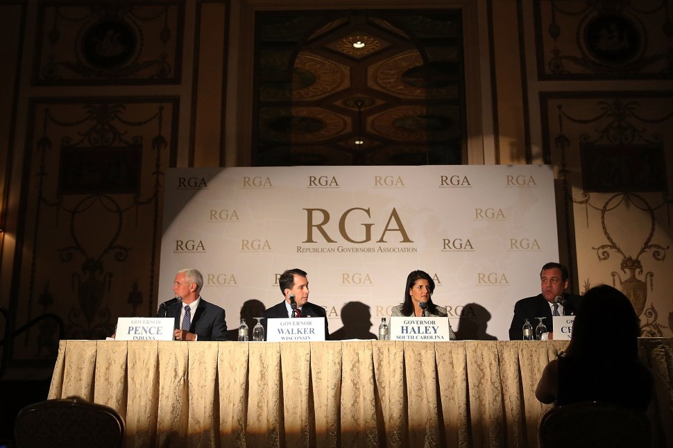 Chris Christie (R) and Mike Pence (L) were joined by South Carolina Gov. Nikki R. Haley and Wisconsin Gov. Scott Walker on May 21, 2014 in New York City at the Republican Governors Association's quarterly meeting. (Spencer Platt/Getty Images)