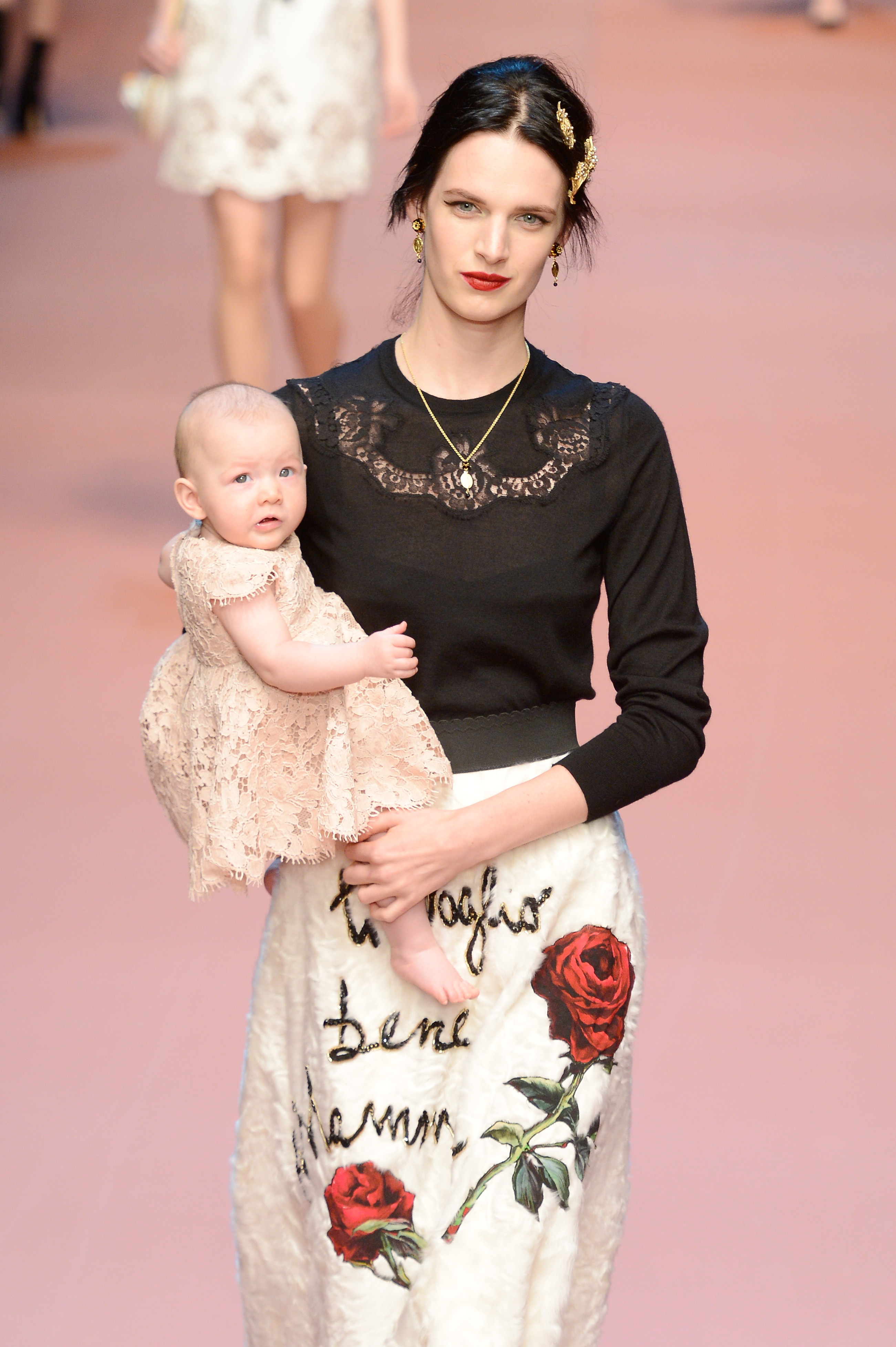 A model with a baby on the Dolce & Gabbana runway (Photo: Getty).