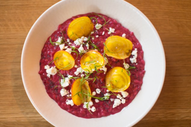 Beetroot risotto with goats cheese, poppy seed, sliced golden beets and dill greens. (Photo: Arman Dzidzovic)