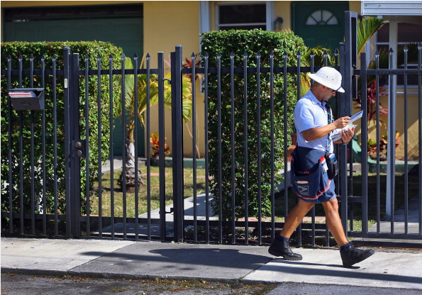 Beware your friendly neighborhood mailman. (Photo: Getty)