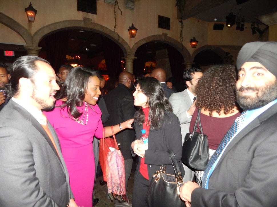 Shah, center left, with Tennille McCoy of Hamilton.