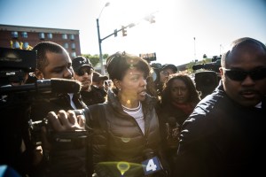 Baltimore Mayor Stephanie Rawlings-Blake speaks to community members and the media near the site of a destroyed CVS pharmacy after riots in Baltimore (Photo by Andrew Burton/Getty Images)