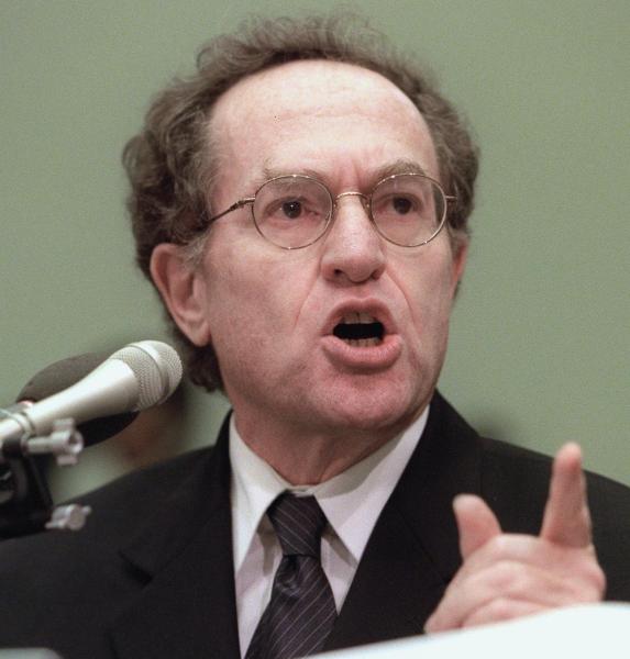 Harvard Law Professor Alan Dershowitz, pictured here defending President Clinton at impeachment hearings on Capitol Hill in Washington, has devoted his career to defending the accused. Suddenly he found himself accused of a preposterous and false charge. (LUKE FRAZZA/AFP/Getty Images)