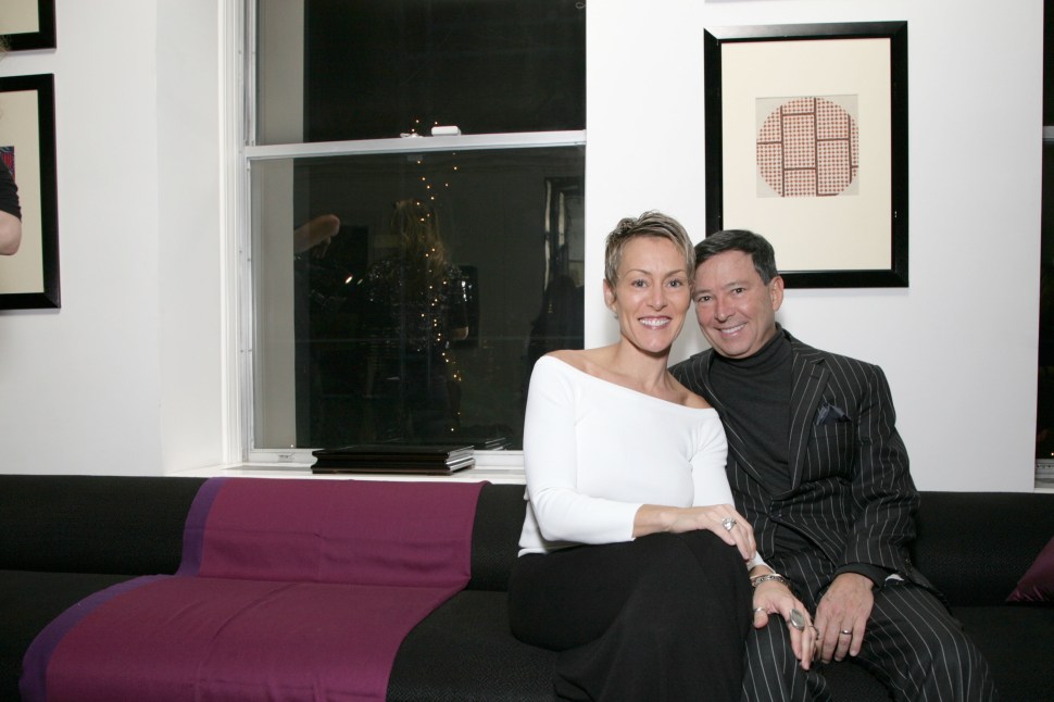 Niko Elmaleh with his wife Bethany Elmaleh on his lap at a Learning Leaders private event in New York City, December 08, 2010 (RICHARD KOEK/PatrickMcMullan.com)