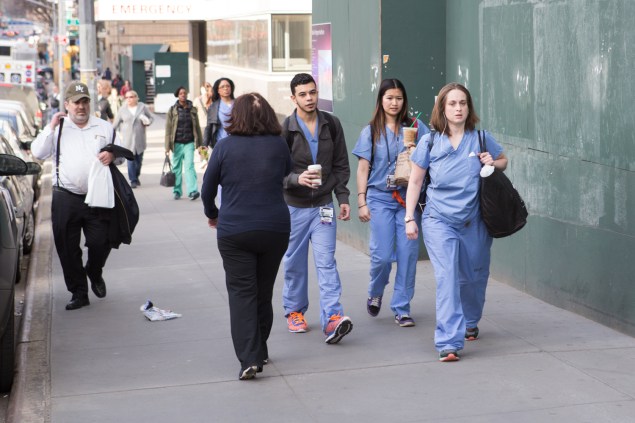 Hospital staff walking to work outside of NYU Langone Medical Center (Arman Dzidzovic/New York Observer)