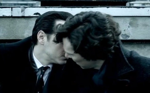 Holmes and Moriarty kiss in an attempt to appease the partisan community on Sherlock. (BBC)
