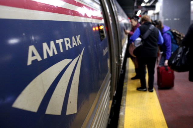 People board an Amtrak train at Penn Station on February 8, 2011 in New York City.  (Photo by Spencer Platt/Getty Images)
