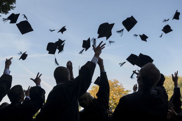 LEIPZIG, GERMANY - AUGUST 30: Graduates in gown and caps celebrate their graduation at the HHL Leipzig Graduate School of Management on August 30, 2014 in Leipzig, Germany. A total of 167 students in various Masters programs of business management graduated today, including the regular MBA program, whose students are 80% from foreign countries, while the more advanced graduate programs have a higher percentage of German-born students. (Photo by Jens Schlueter/Getty Images)