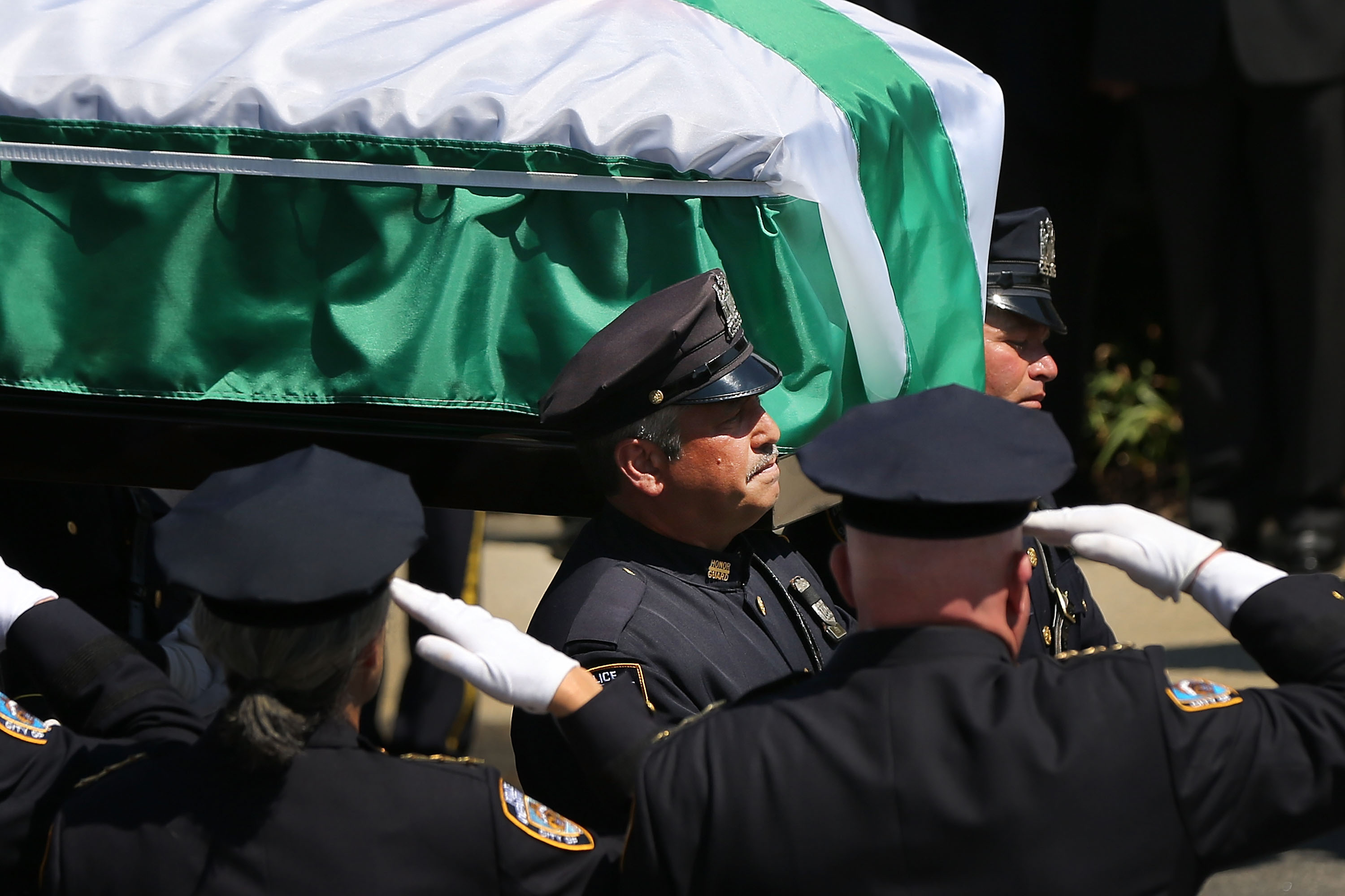 The casket for fallen New York City police officer Brian Moore is brought into a Long Island church on May 8, 2015 in Seaford, New York. (Photo by Spencer Platt/Getty Images)