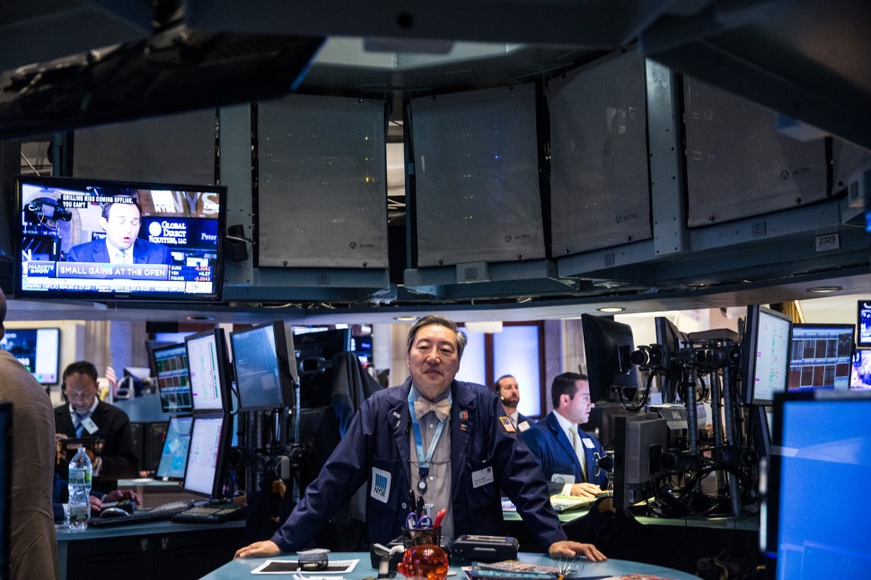 NEW YORK, NY - MAY 15: Traders work on the floor of the New York Stock Exchange during the morning of May 15, 2015 in New York City. The Dow Jones Industrial Average was slightly down in morning trading after it closed near its record high yesterday. (Photo by Andrew Burton/Getty Images)