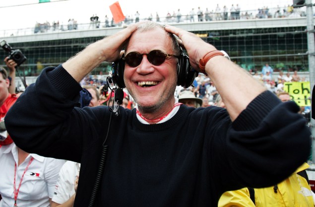INDIANAPOLIS, IN - MAY 30: David Letterman, co-owner of the #15 Rahal-Letterman Argent/Pioneer G Force Honda of Buddy Rice smiles when the rains started to fall to cause the race to be shortened and win the 88th running of the Indianapolis 500 part of the IRL IndyCar Series on May 30, 2004 at the Indianapolis Motor Speedway in Indianapolis, Indiana.(Photo by Robert Laberge/Getty Images)