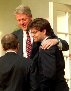 U.S. President Bill Clinton (C) speaks to White House Chief of Staff Thomas McLarty (L) 29 May, 1993 with his arm around George Stephanopoulos (R) in the Rose Garden of the White House.  (Photo: JENNIFER LAW/AFP/Getty Images)