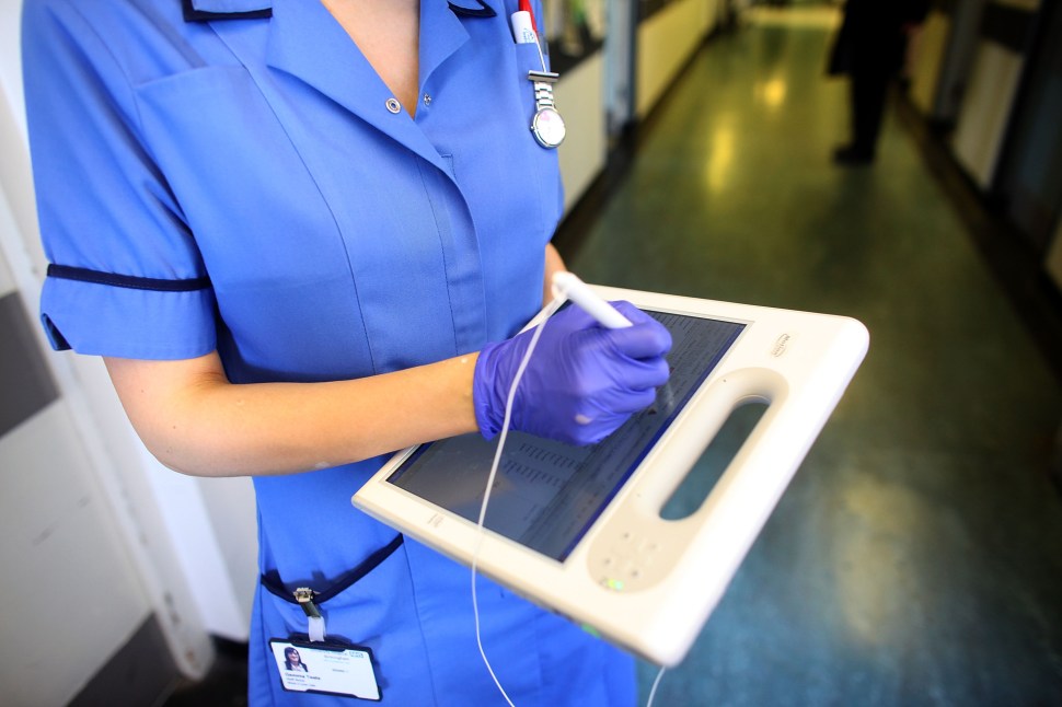A nurse uses a wireless electronic tablet to order medicines from the pharmacy at The Queen Elizabeth Hospital on March 16, 2010 in Birmingham, England.  (Photo: Christopher Furlong/Getty Images)