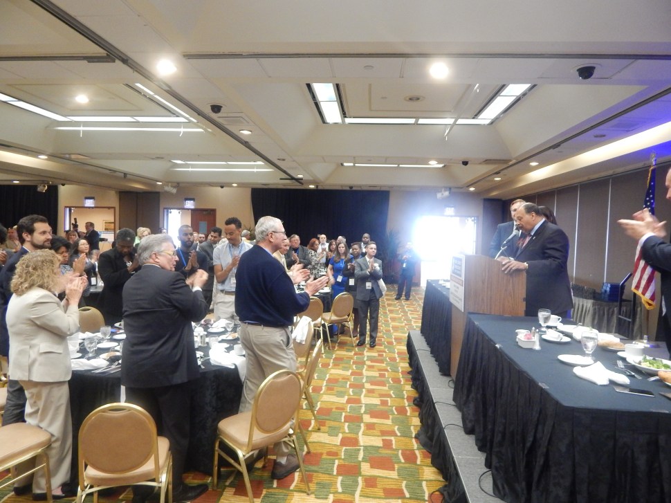 Currie gets a standing ovation at Friday's luncheon.