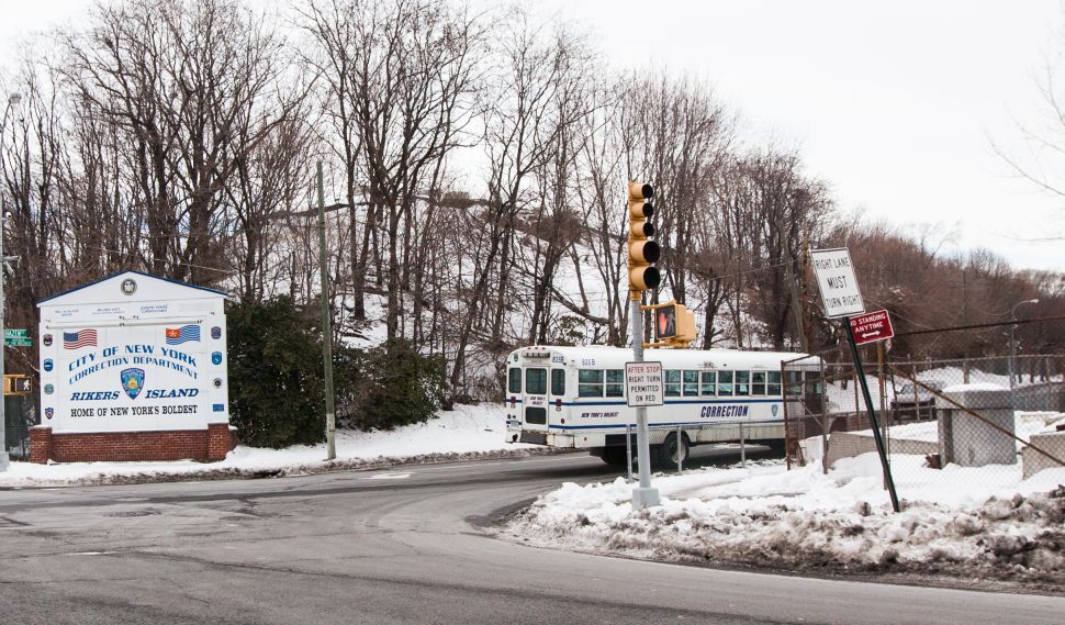 A Department of Correction bus outside Rikers island (Photo by Emily Assiran/New York Observer)