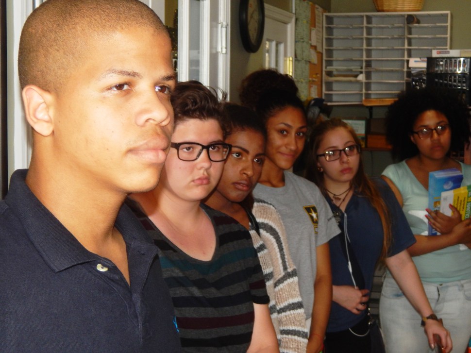 Elizabeth students listen to a pre-Election Day speech Saturday by Rafael Fajardo, who's supporting his old ally, Board of Education Member Tony Monteiro.