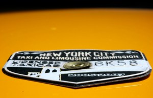 Medallion attached on the hood of a taxicab