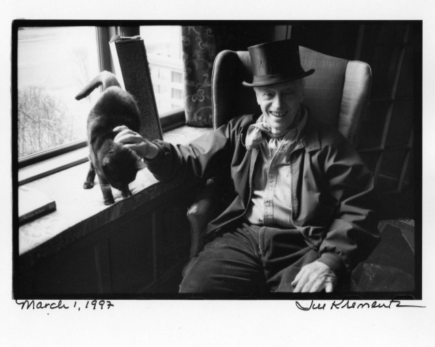 CAT AND A HAT: Bellow, winner of the 1976 Nobel Prize in literature, is wearing the top hat he wore to accept his honor in Stockholm. Bellow described his companion as "Moose, a fine black tom with a white throat who looks like a maitre d'hotel. He shares my bed daily. My siesta lasts for an hor. He sleeps some twenty hours a day." One a castoff kitten discovered clinging to a screen door, Mose is now seven years old."