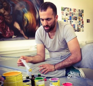 Artist Khaled Jarrar prepares the paint cans for his performance and the opening of his show. (Photo Courtesy Art Bärtschi & Cie via Facebook)