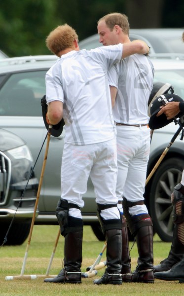 Prince Harry threw his arm around Will's shoulders. Aww! (Photo: Getty)