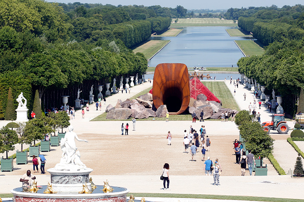 An artwork named "Dirty Corner" by British contemporary artist Anish Kapoor, is displayed in the gardens of the Chateau de Versailles during  the exhibition of his works, opening June 9 and running through November 1. (Photo by Chesnot/Getty Images) 